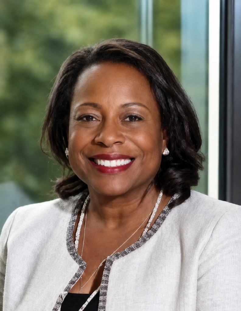 Professional smiling woman headshot near window
