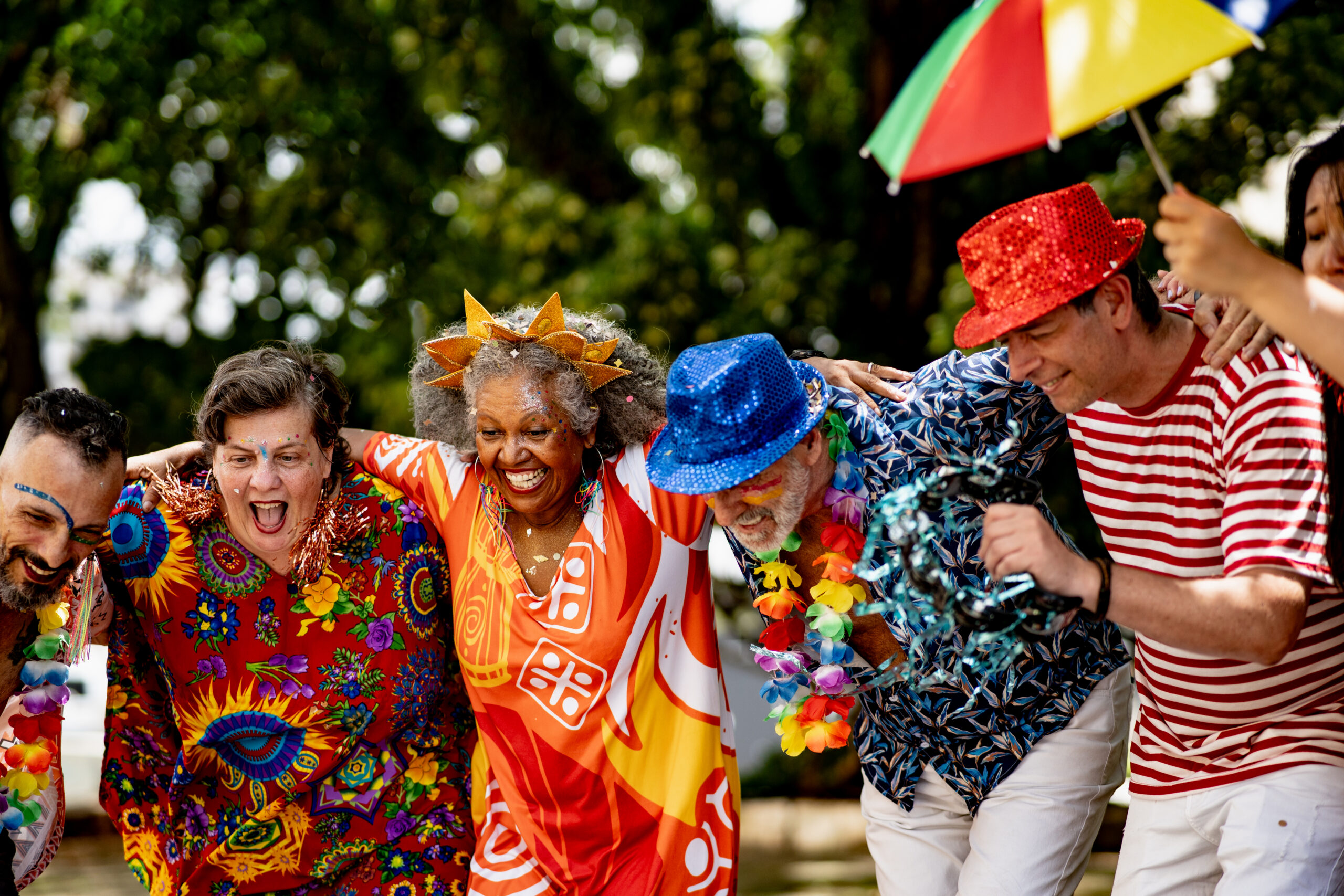 Festive group celebrating with colorful outfits