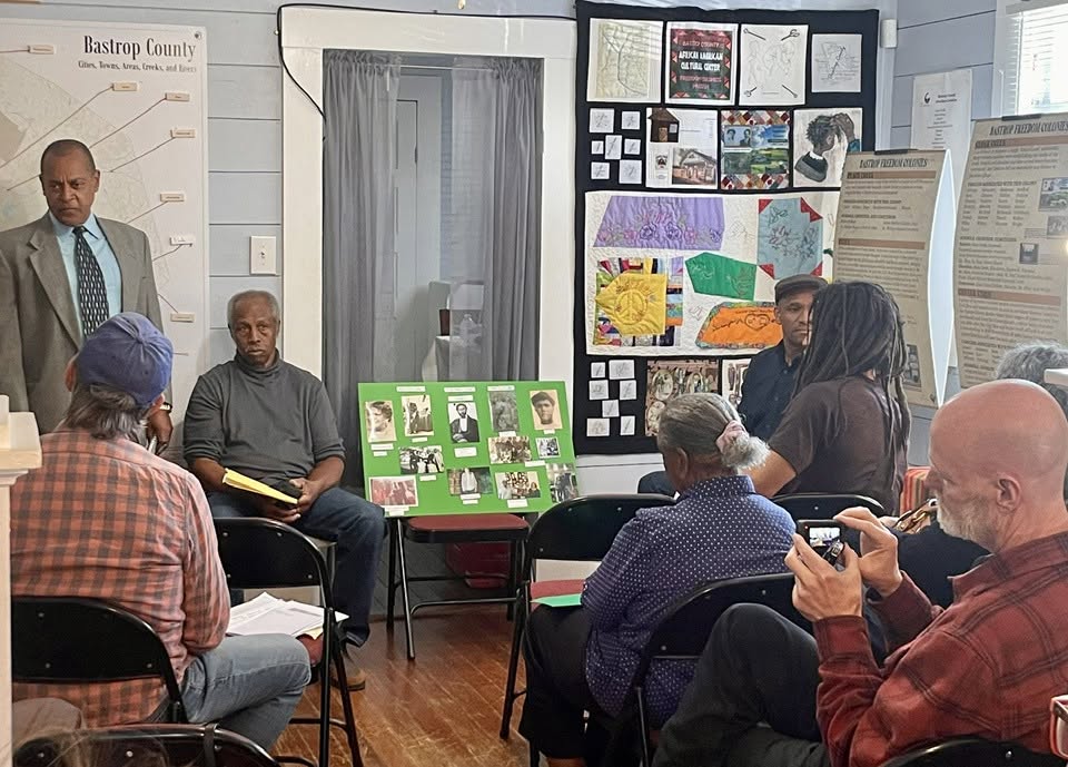 Community meeting with poster presentation and attendees