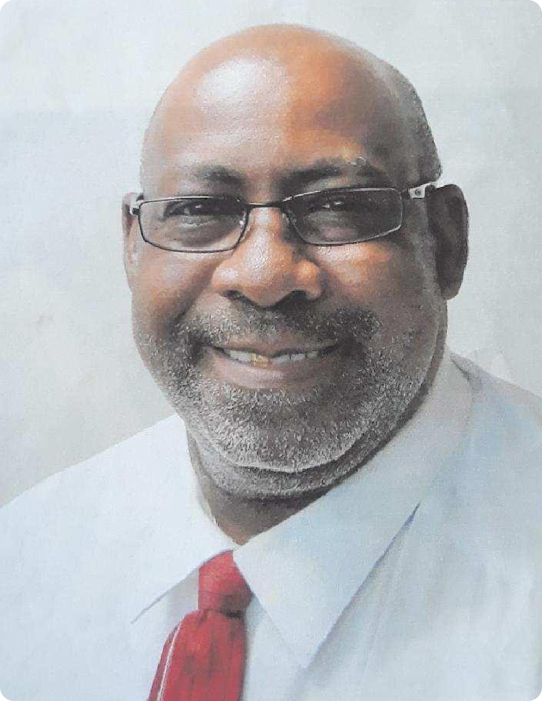 Smiling bald man with glasses and red tie