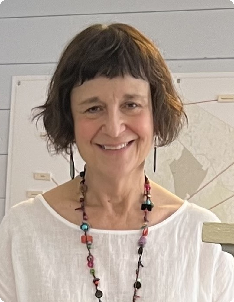 Smiling woman wearing colorful beaded necklace