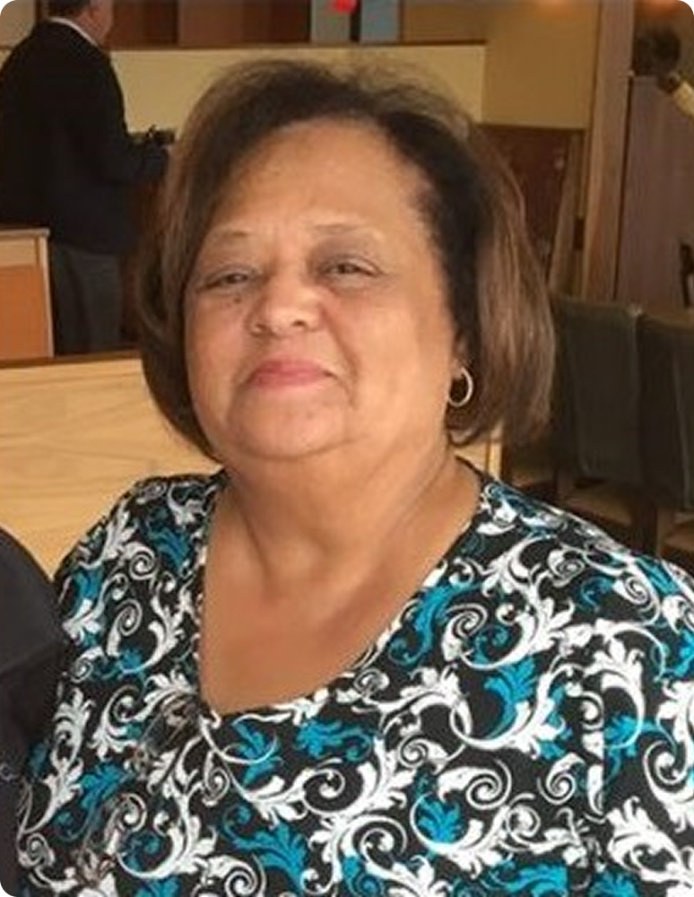 Smiling older woman wearing patterned blouse